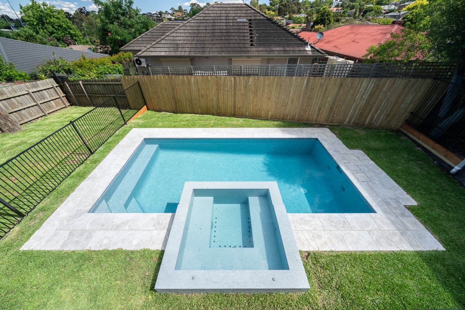 Complete Enchanted concrete pool and raised spa setting