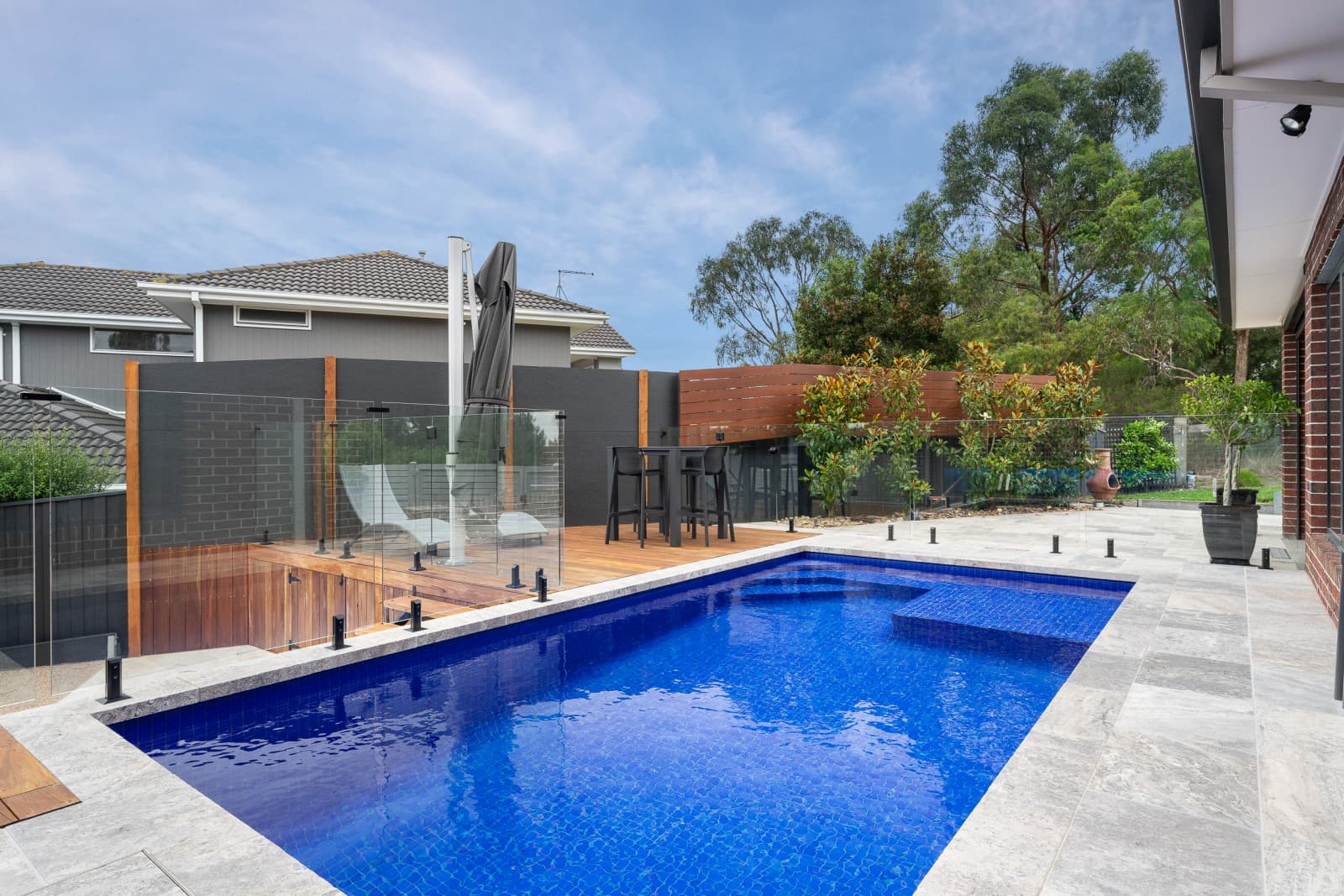 Deep-blue pool, poolside setting