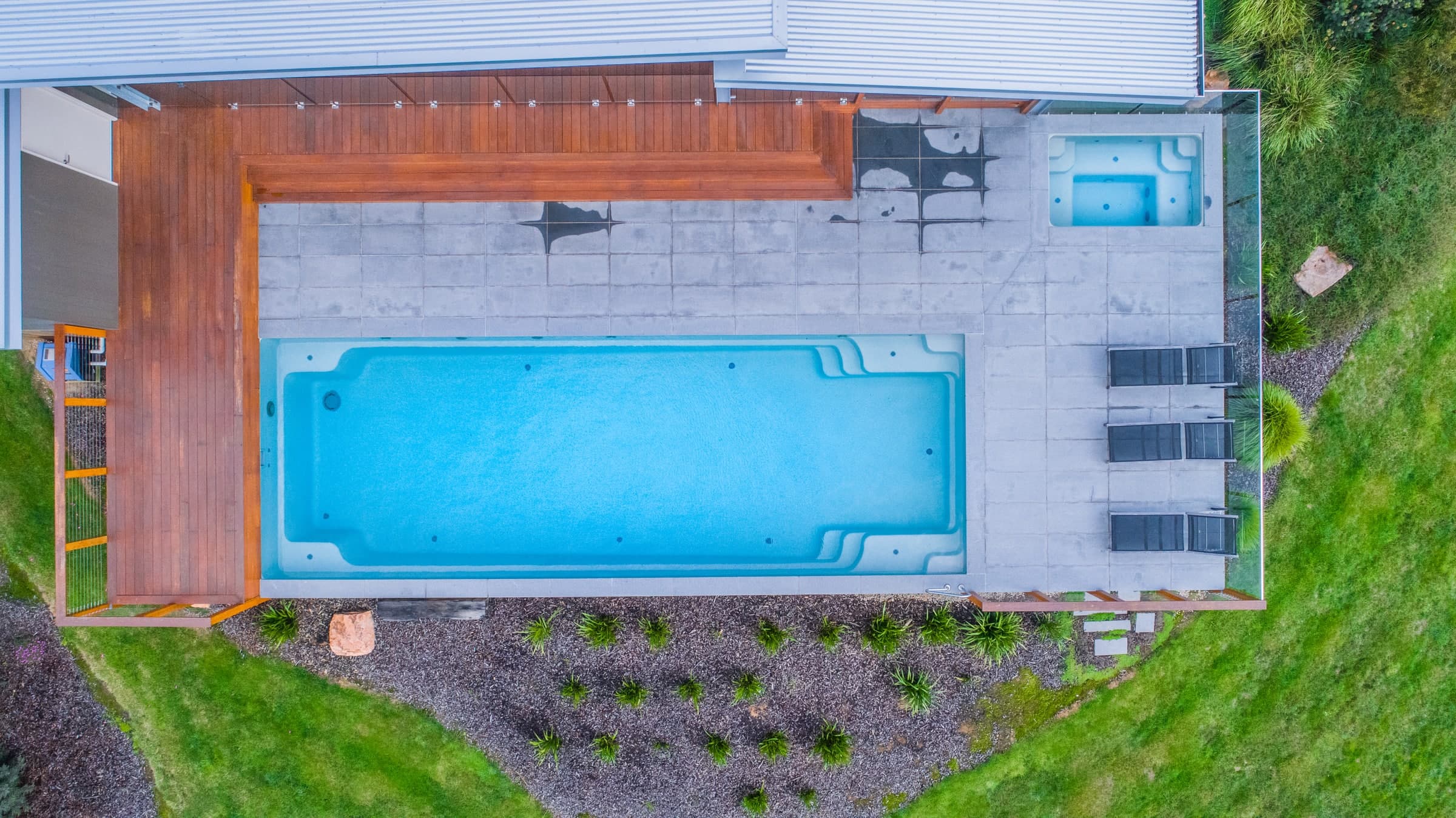Top-down view of an X-Trainer pool beside a timber deck