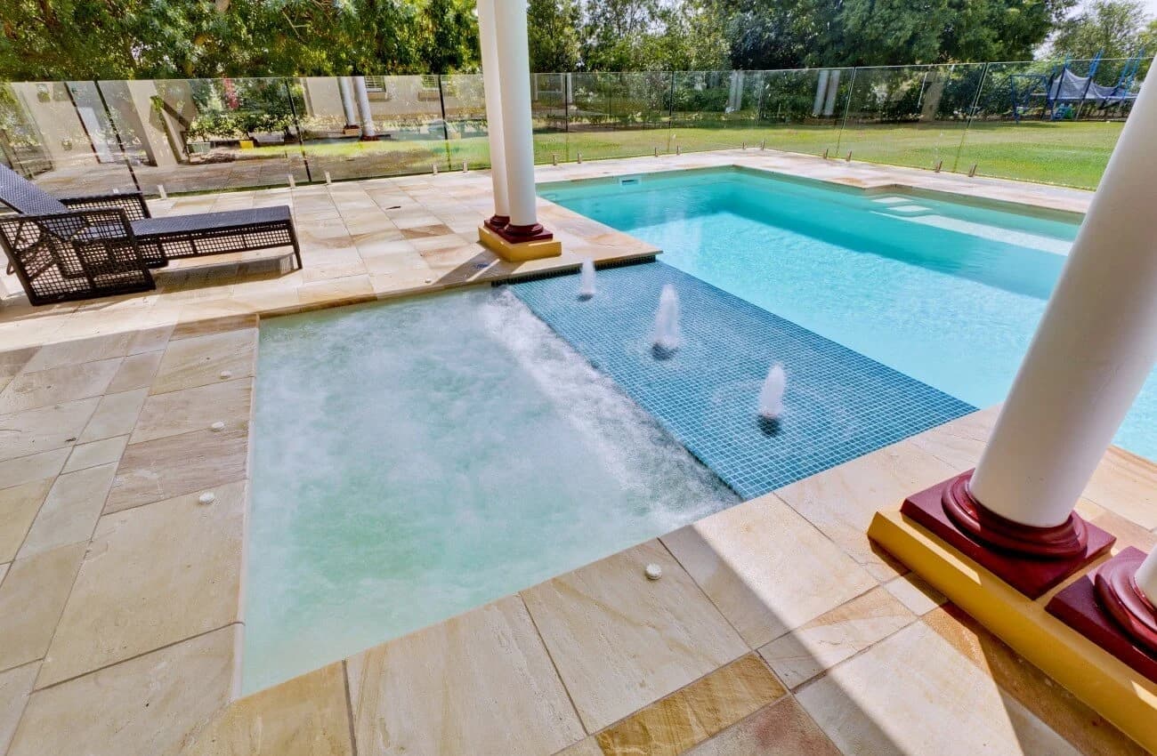 Compass shallow fibreglass water zone beside a residential pool