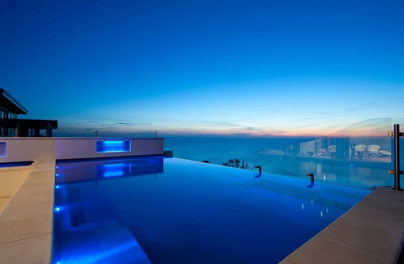 Compass X-Trainer fibreglass pool with a negative edge overlooking a view