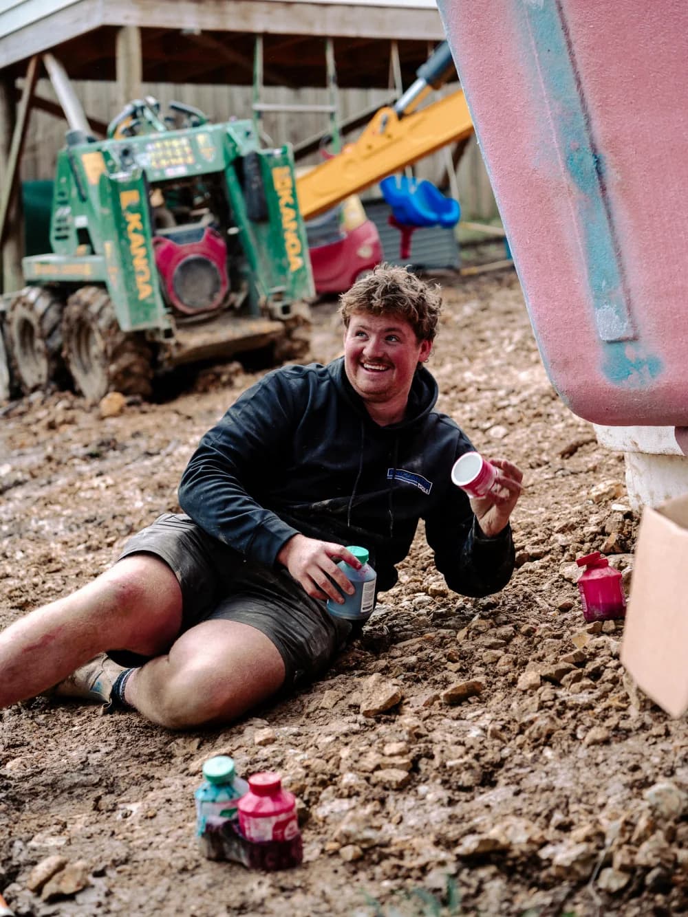 Enchanted Pools team member working beside a fibreglass pool shell