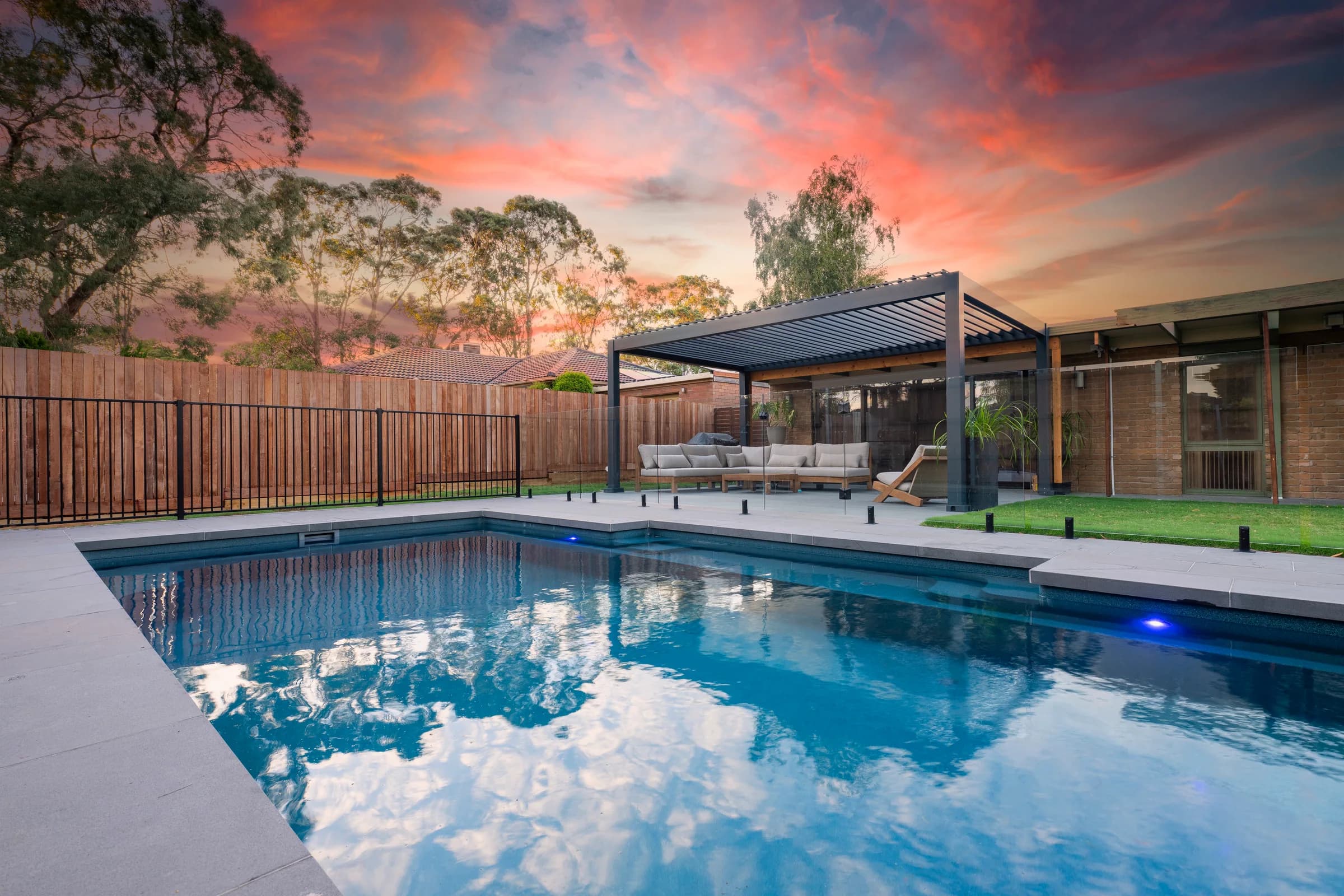 Front garden pool, pergola and outdoor lounge at sunset in Berwick