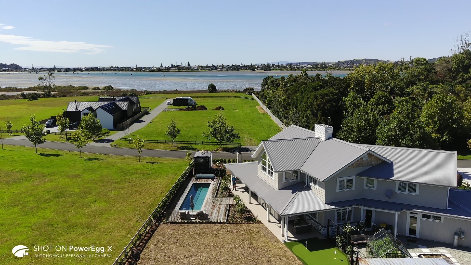 Fastlane lap pool and grey home viewed from above