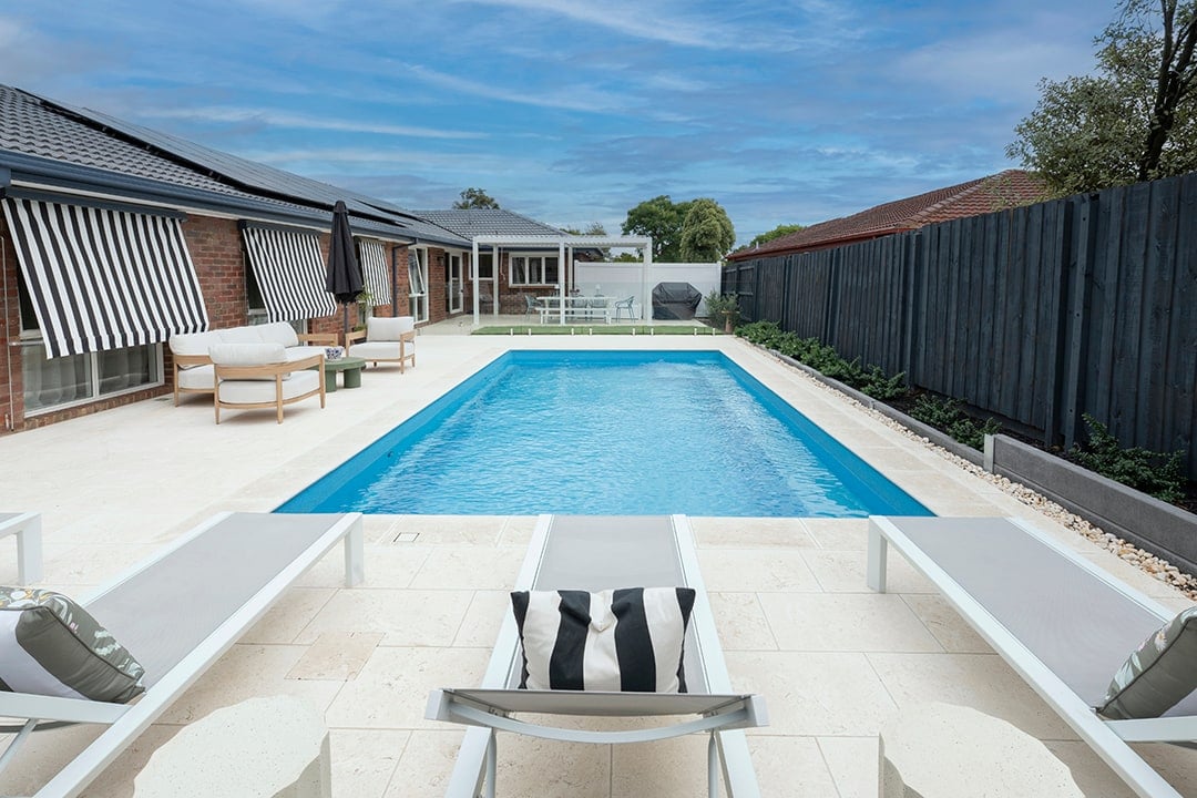 Long view from the alfresco along the pool towards the house in Rowville