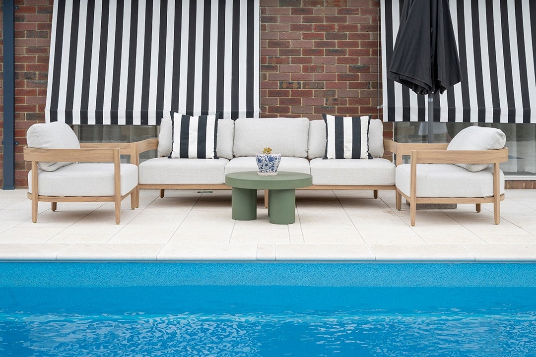 Poolside lounge setting and limestone coping in Rowville