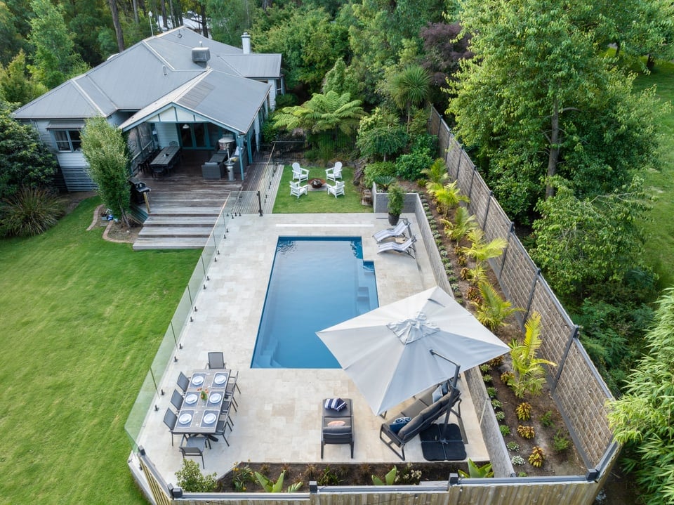 Aerial view of the completed pool and sloping garden in Emerald