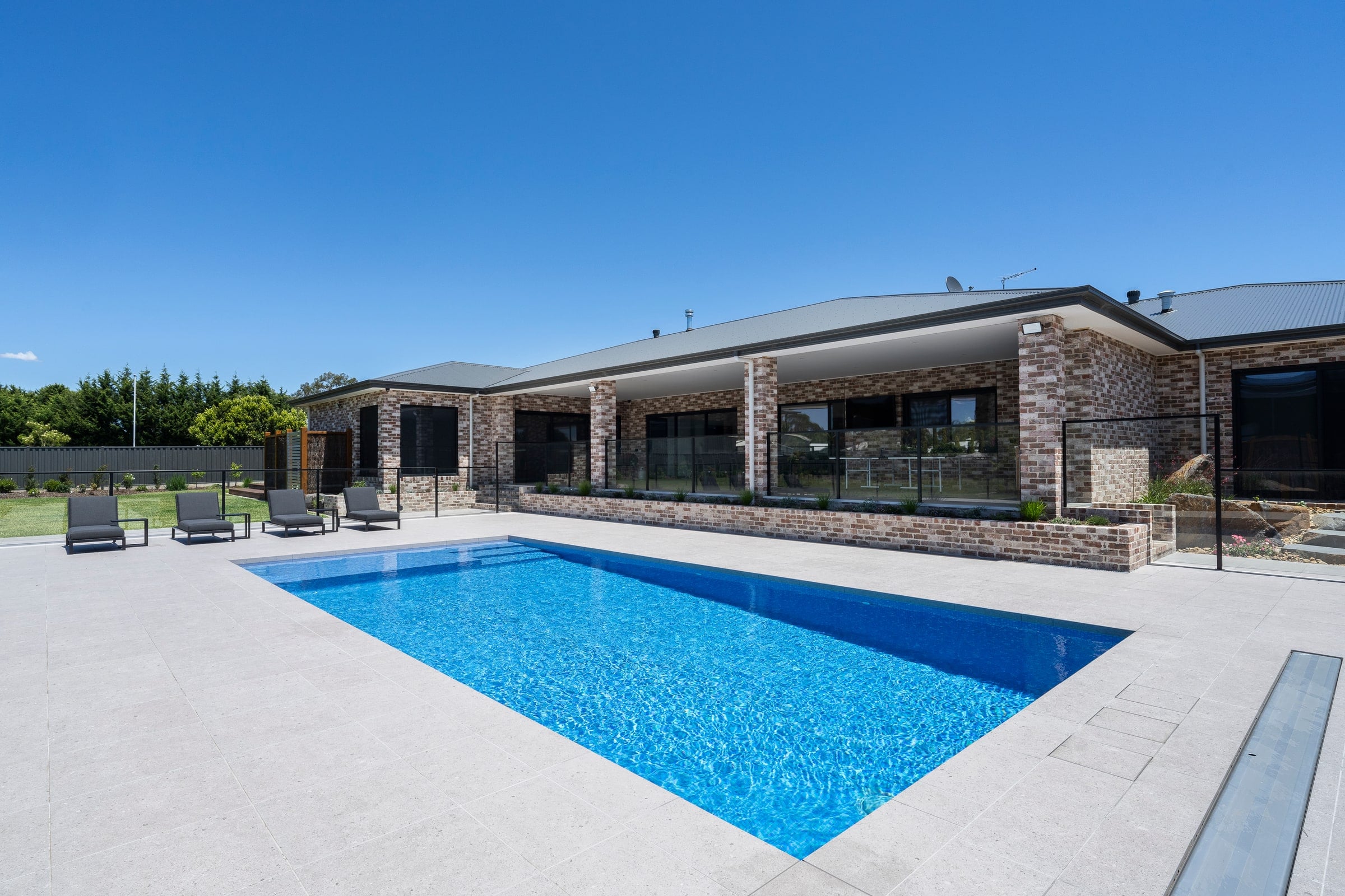 Fully tiled concrete pool beside the home in Cranbourne