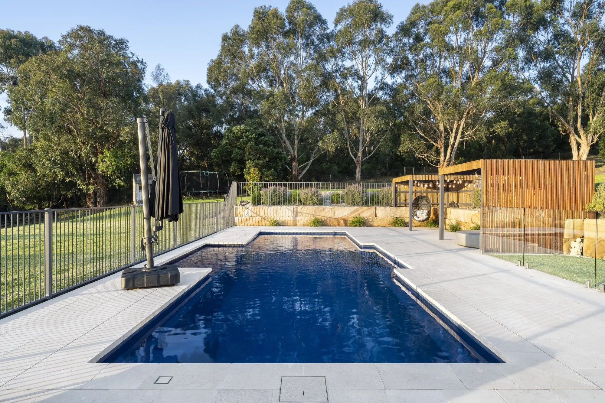 Pool, lawn and bushland outlook in Lysterfield South