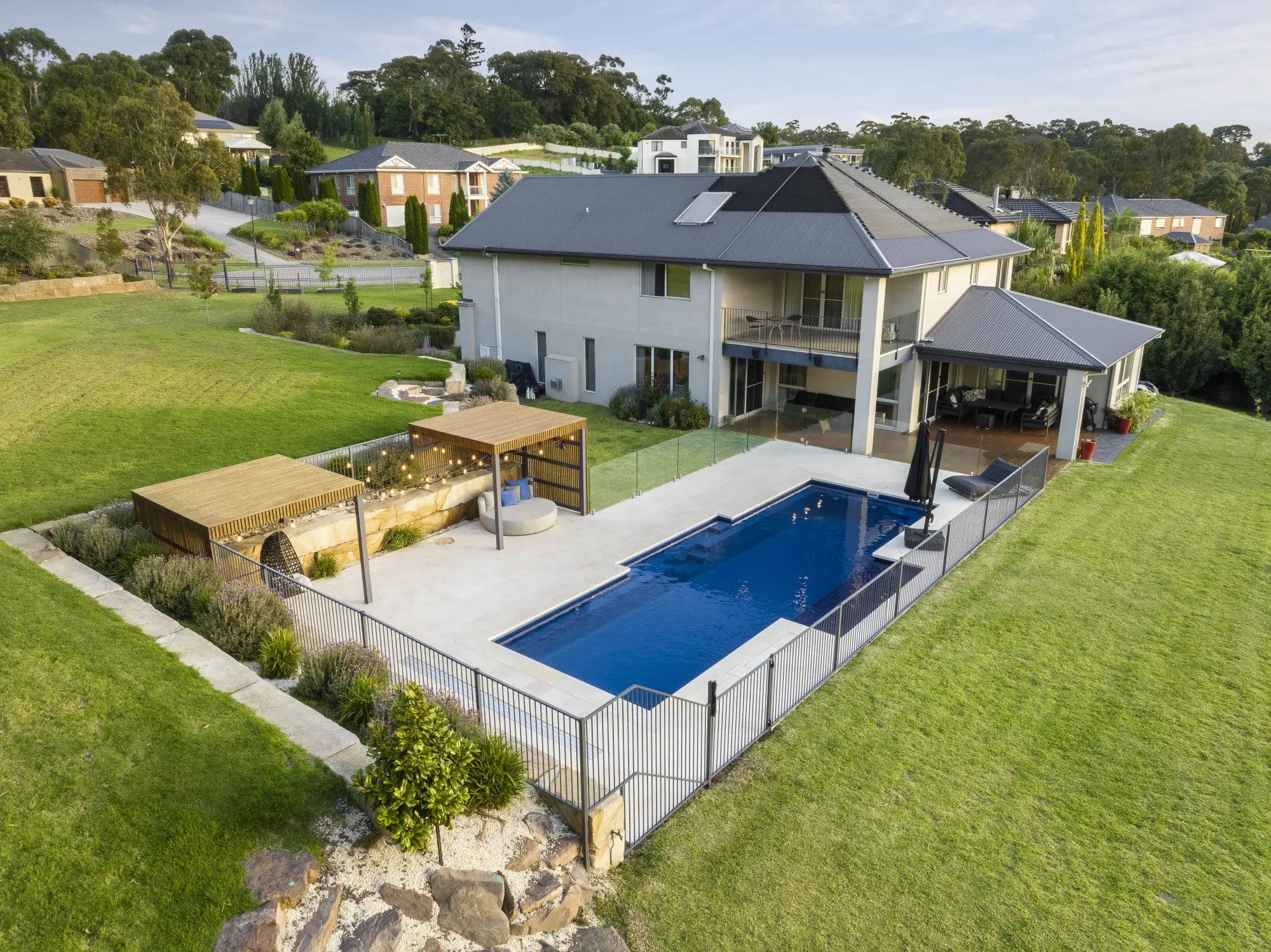 Aerial view of the pool, sun pod and garden in Lysterfield South