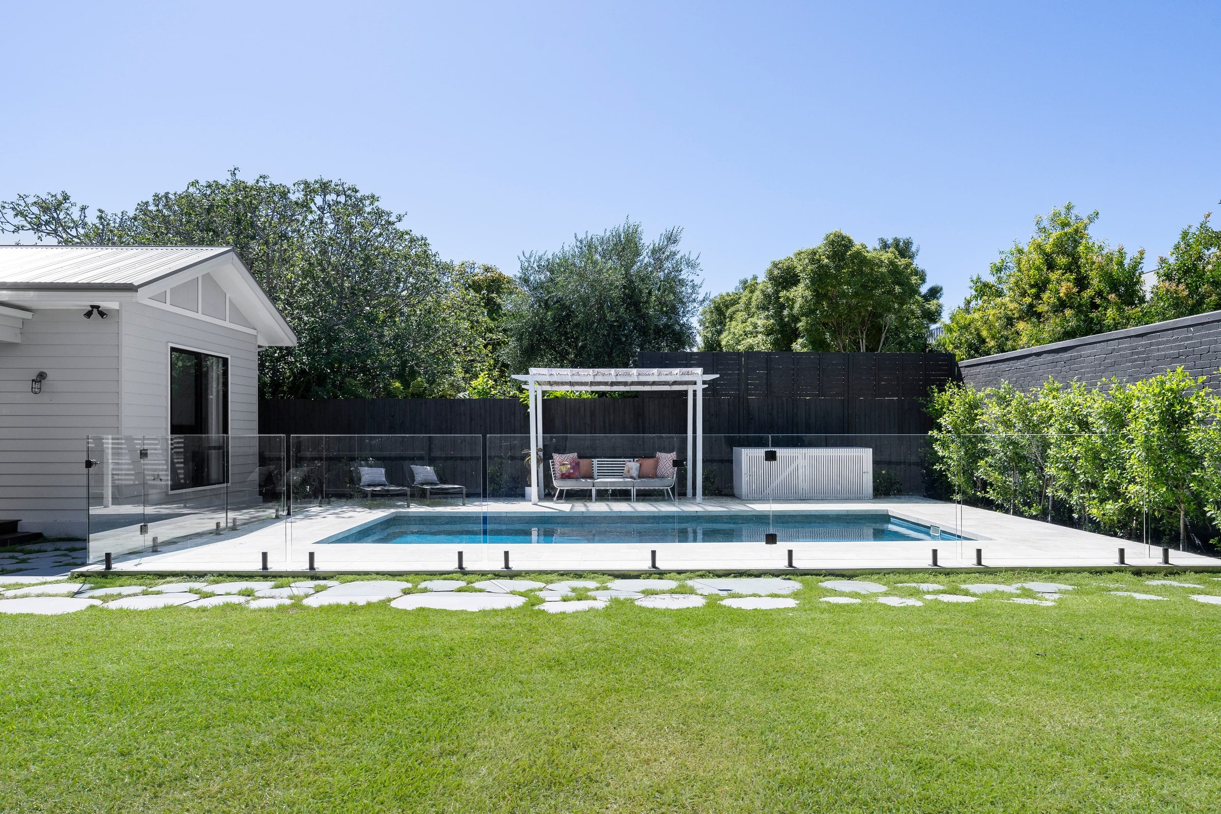Pool and studio viewed across the lawn in Carnegie