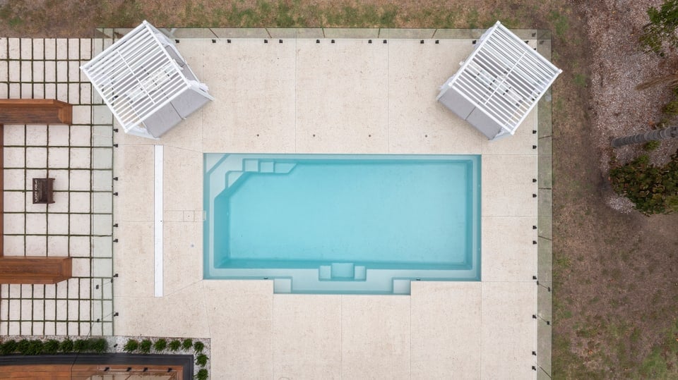 Aerial view of the pool, terrazzo surrounds and day beds in Pearcedale