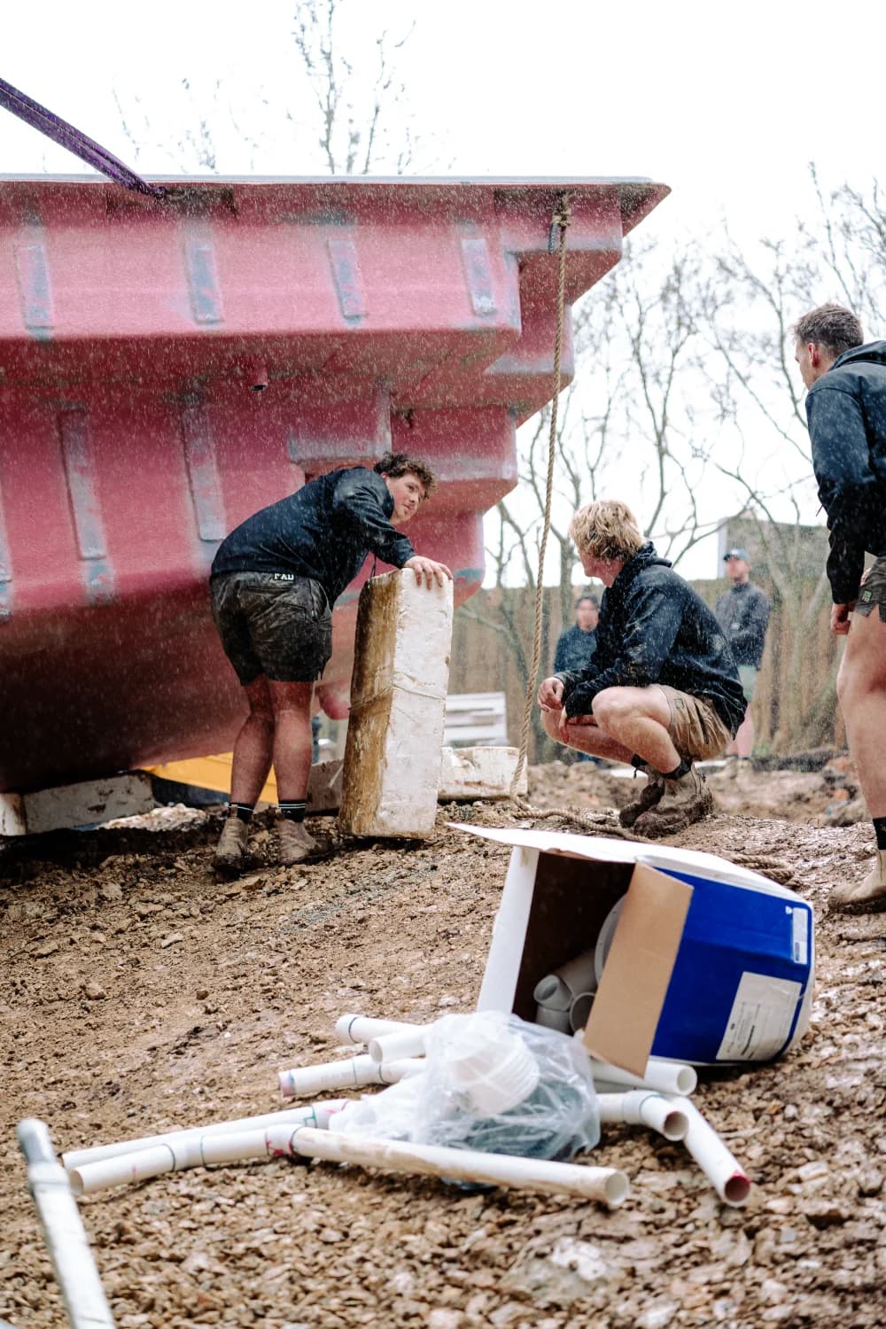Enchanted Pools installation team coordinating a fibreglass pool placement