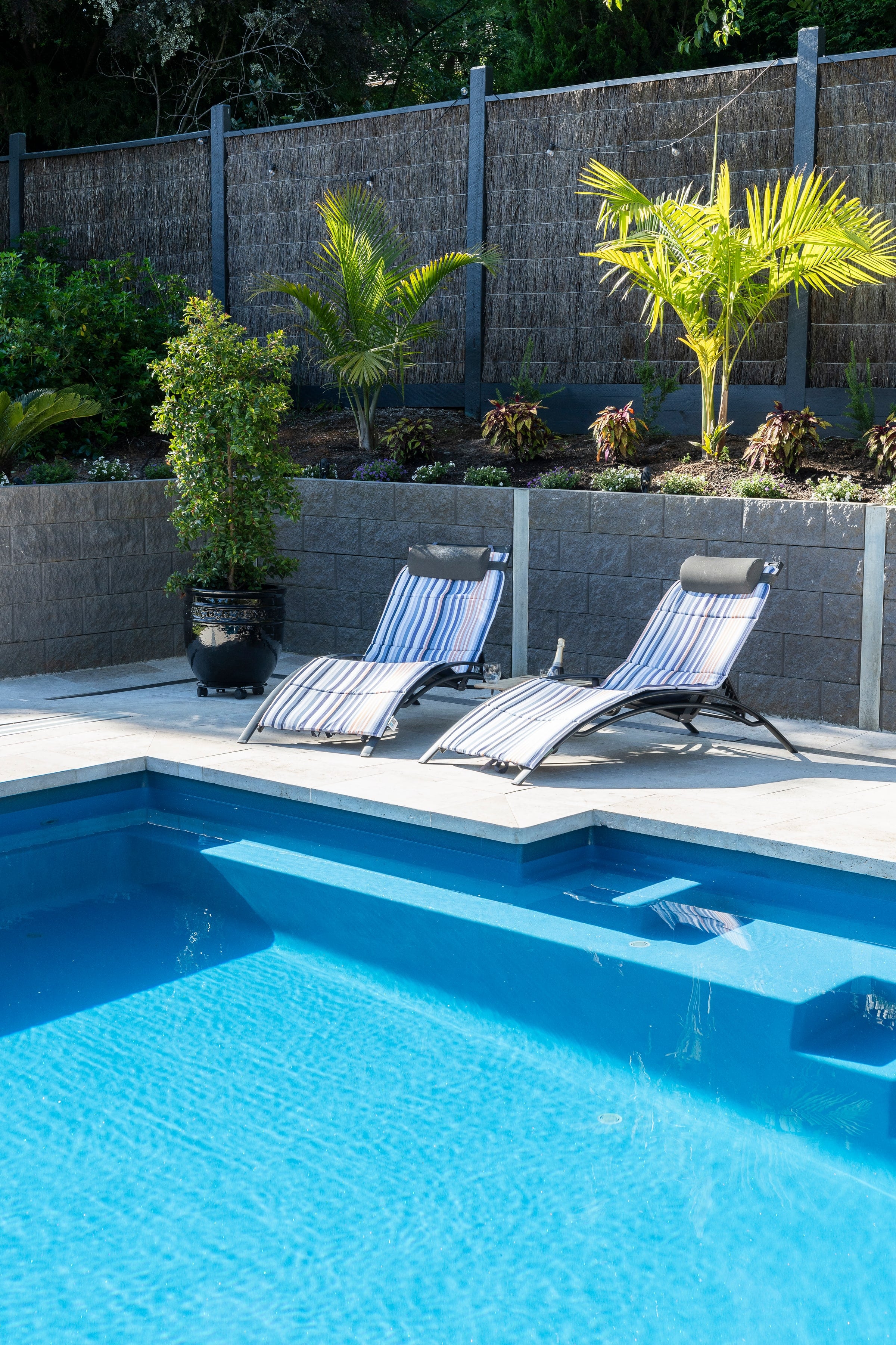 Entry shelf and poolside seating beside the Emerald pool
