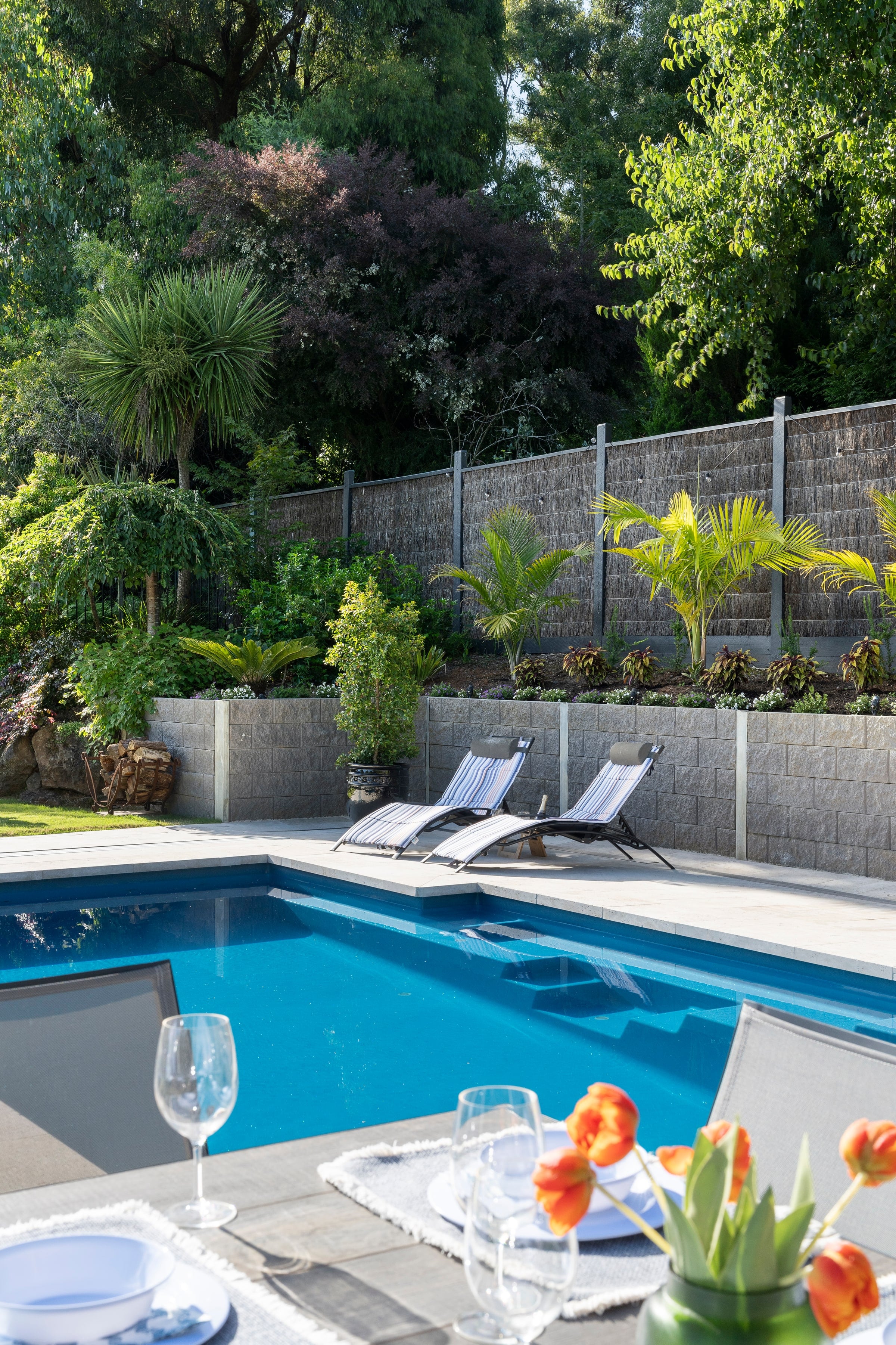 Terraced planting and pool edge on the Emerald hillside