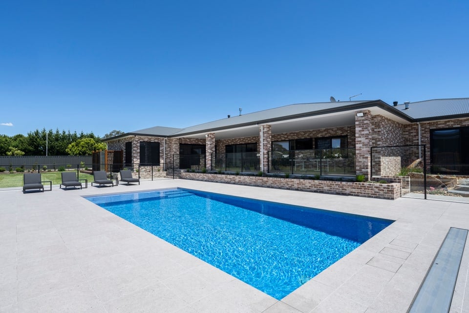 Fully tiled concrete pool beside the home in Cranbourne