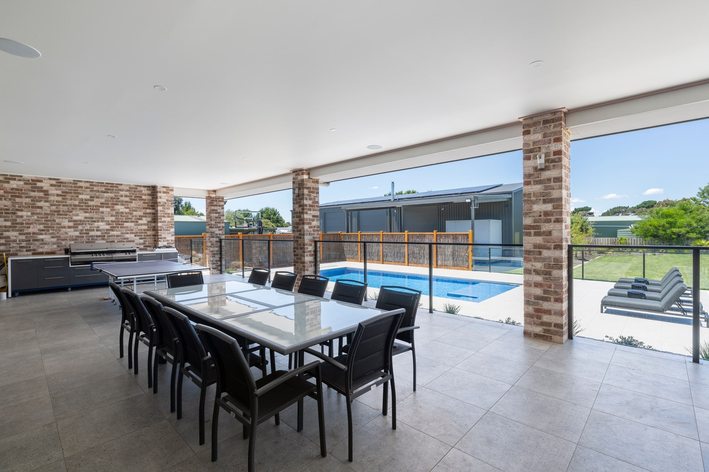 Covered alfresco and outdoor dining area beside the pool in Cranbourne