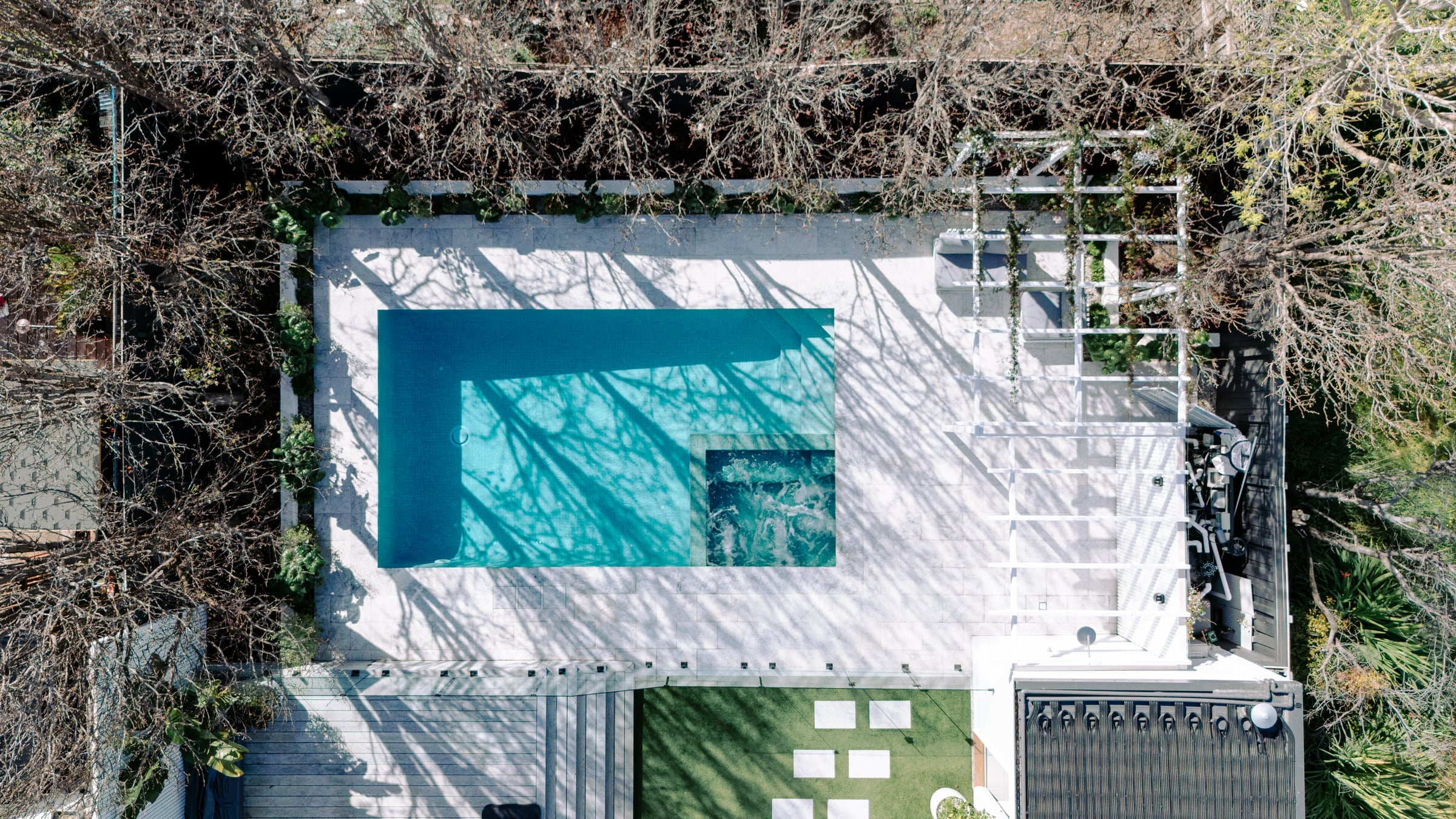Overhead view showing the pool, spa, garden and outdoor living areas together