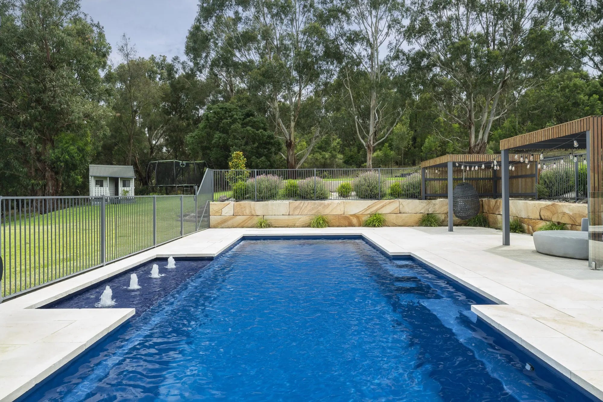 Long view along the pool towards the cabana in Lysterfield South