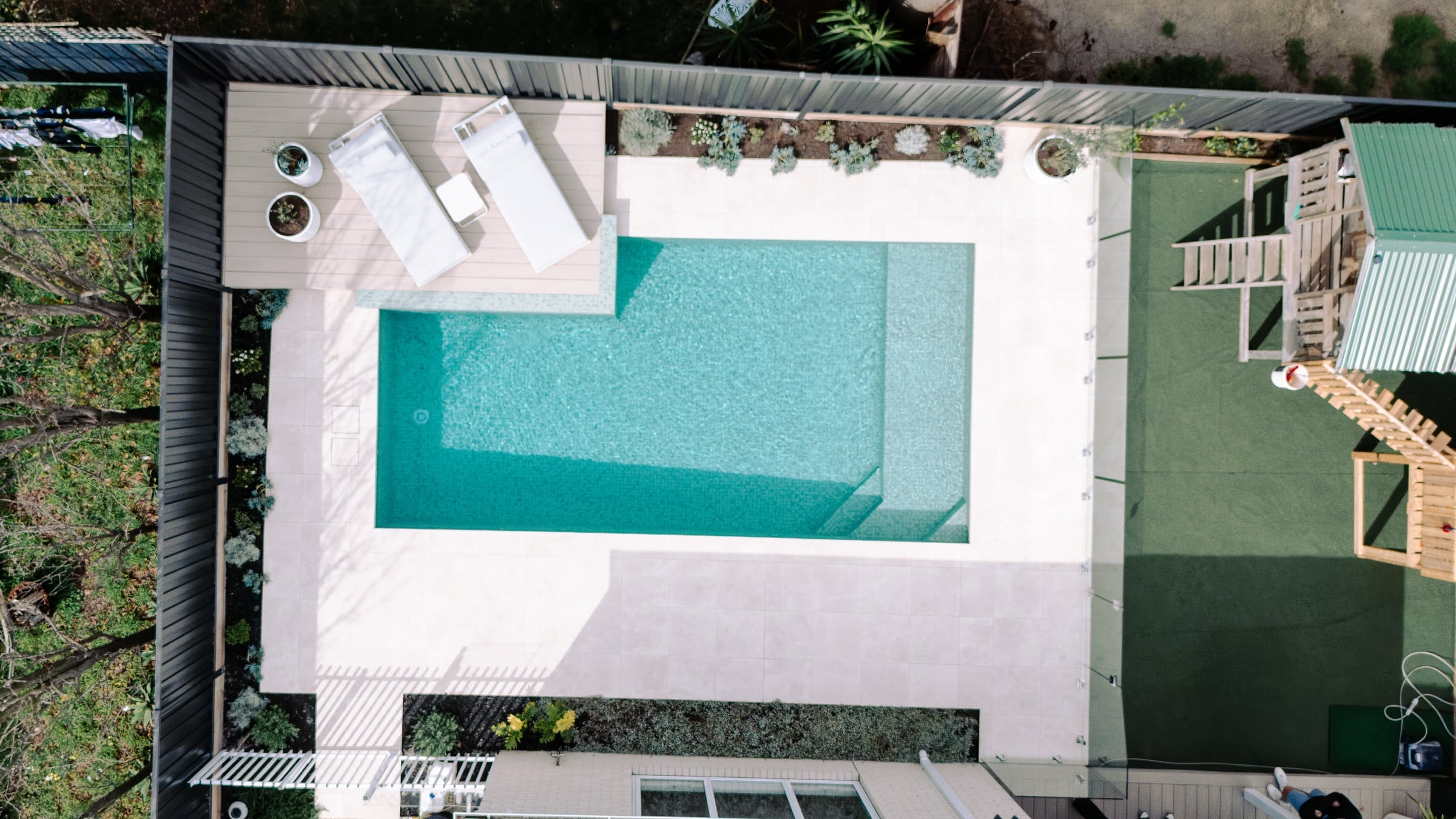 Aerial view of the Bentleigh East pool and raised deck within the backyard