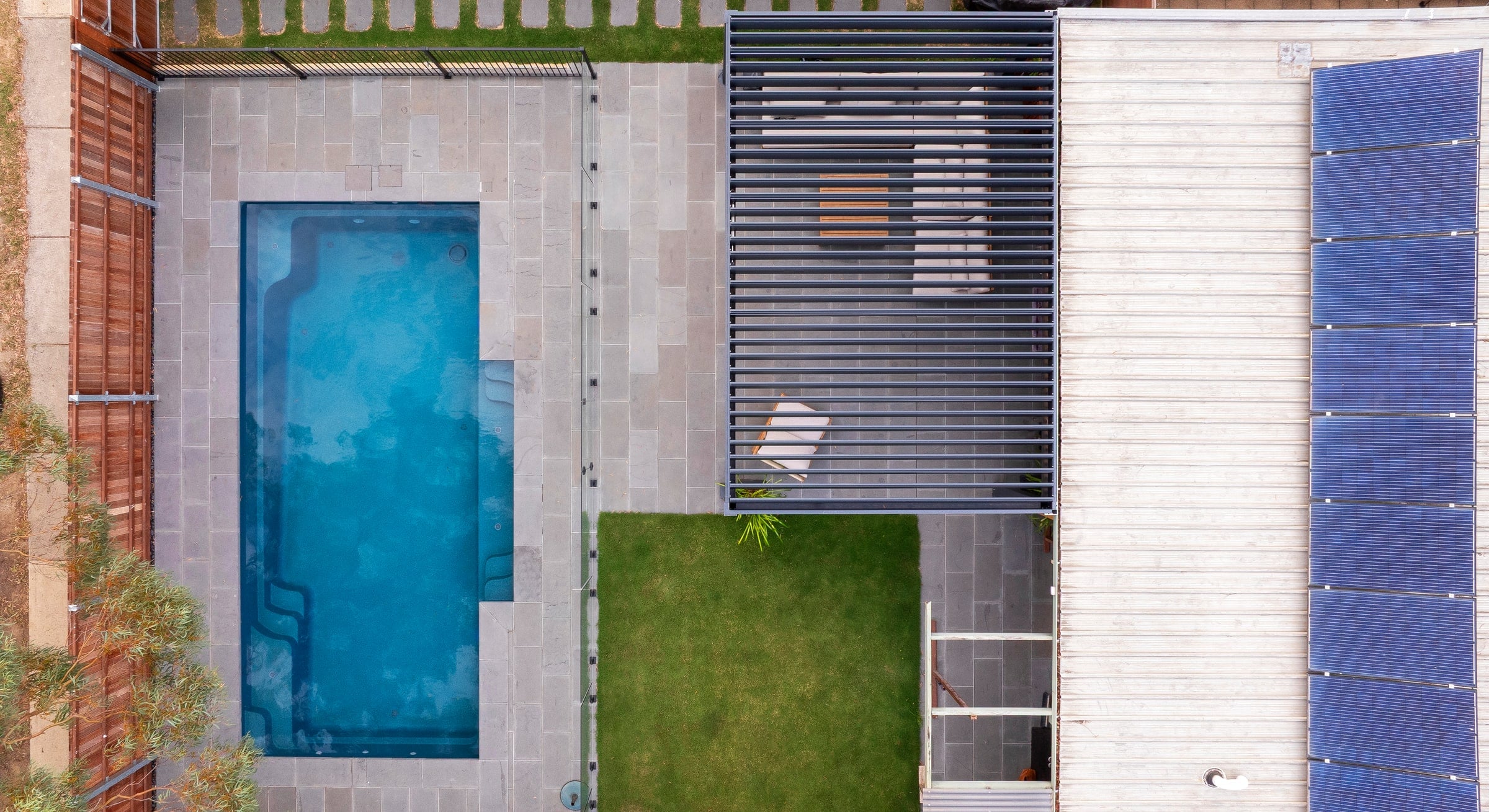Overhead view of the front garden pool and paved surround in Berwick