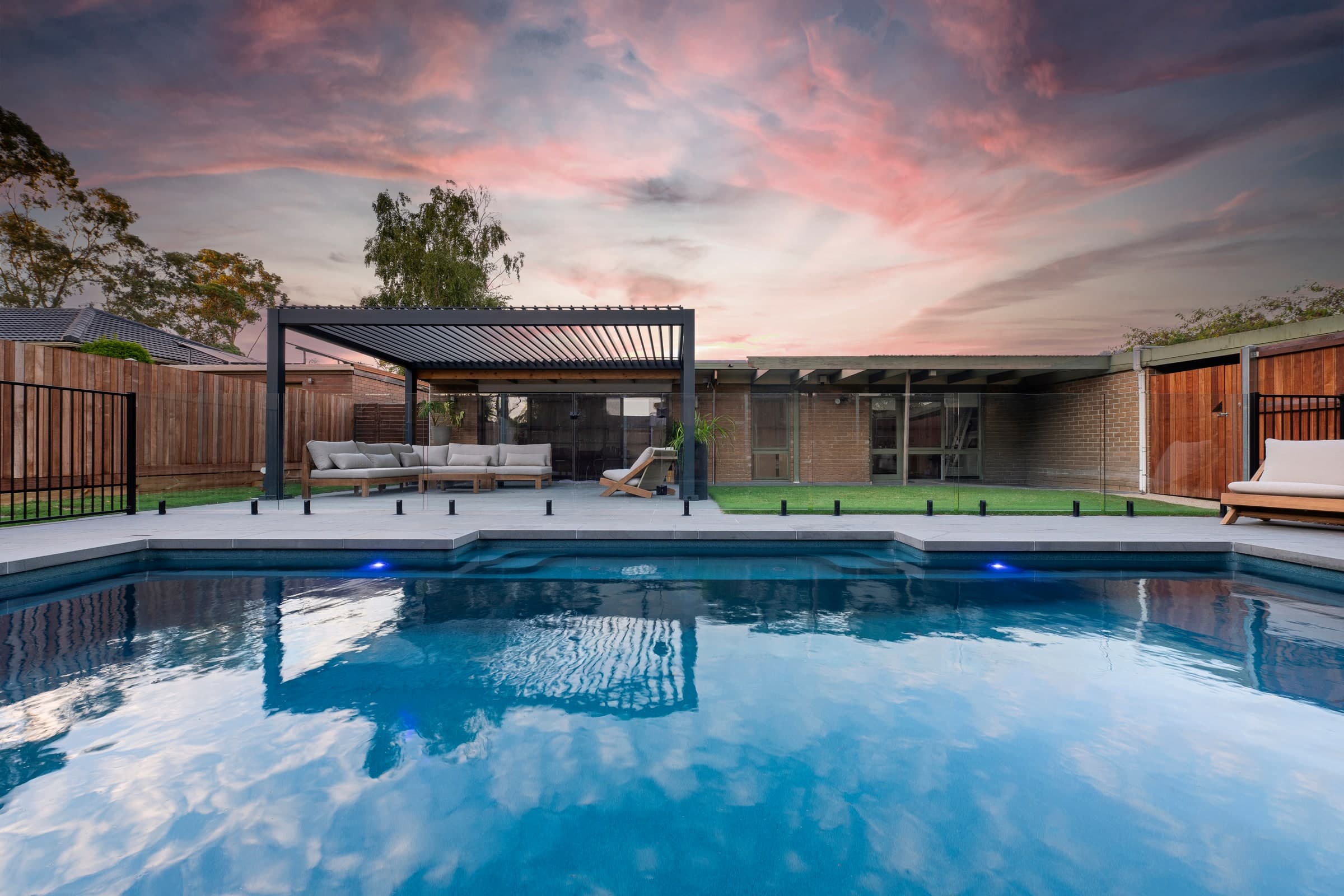 Evening view across the front garden pool towards the house in Berwick